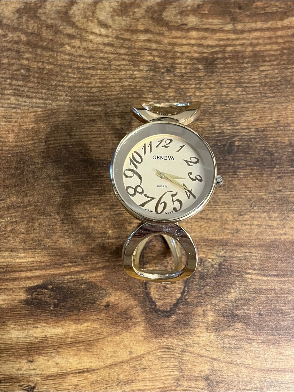 Geneva Silver Tone Round Wall Clock with Curved Accents